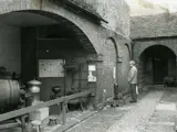 museum display of machinery in brick archway