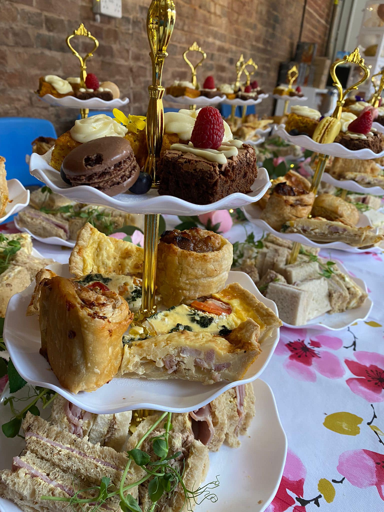 several afternoon tea stands set up on table