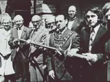 black and white old photo of group of people at museum opening