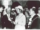 black and white old photo of group of people at royal visit