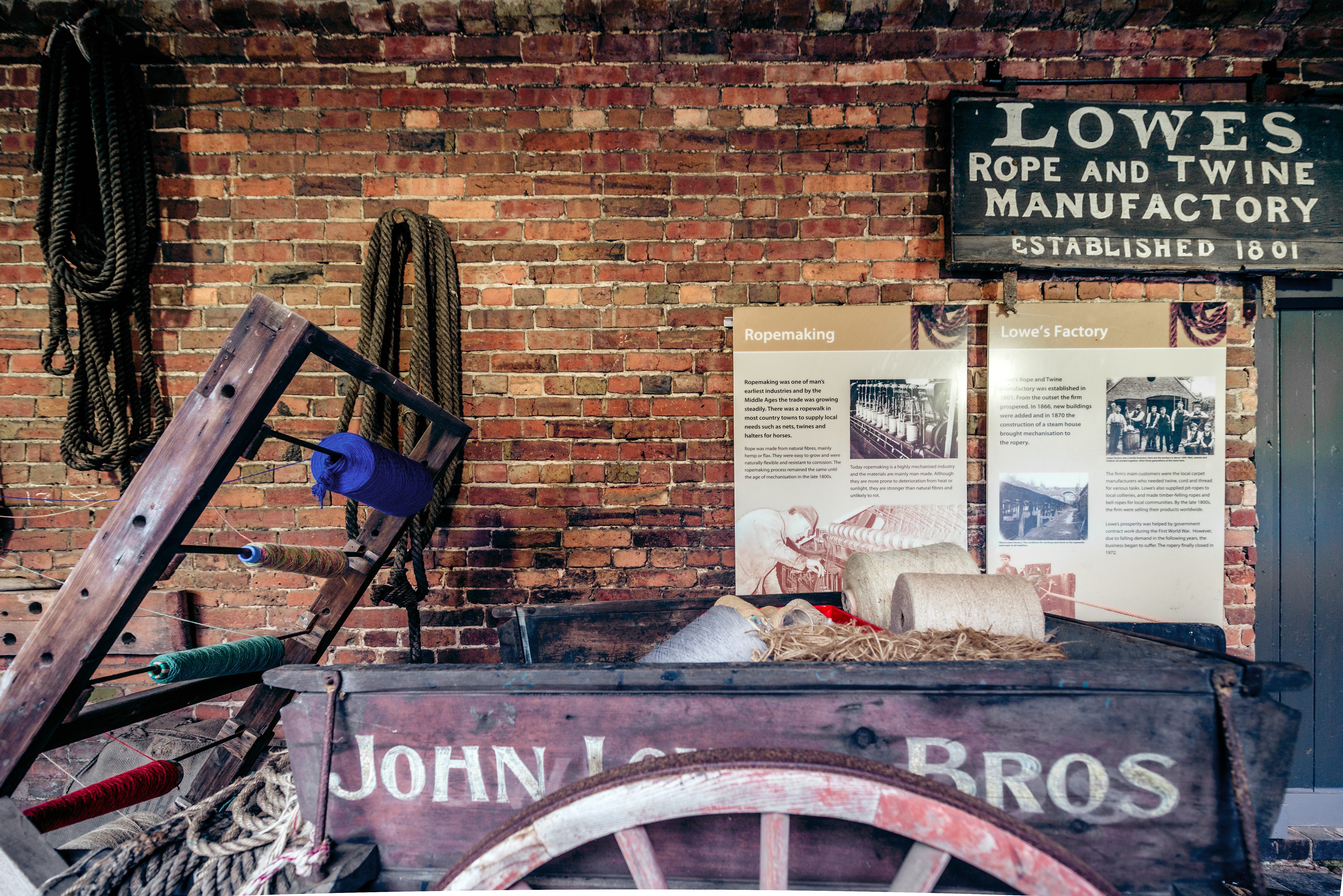 exhibition of old cart and rope making equipment with information boards behind
