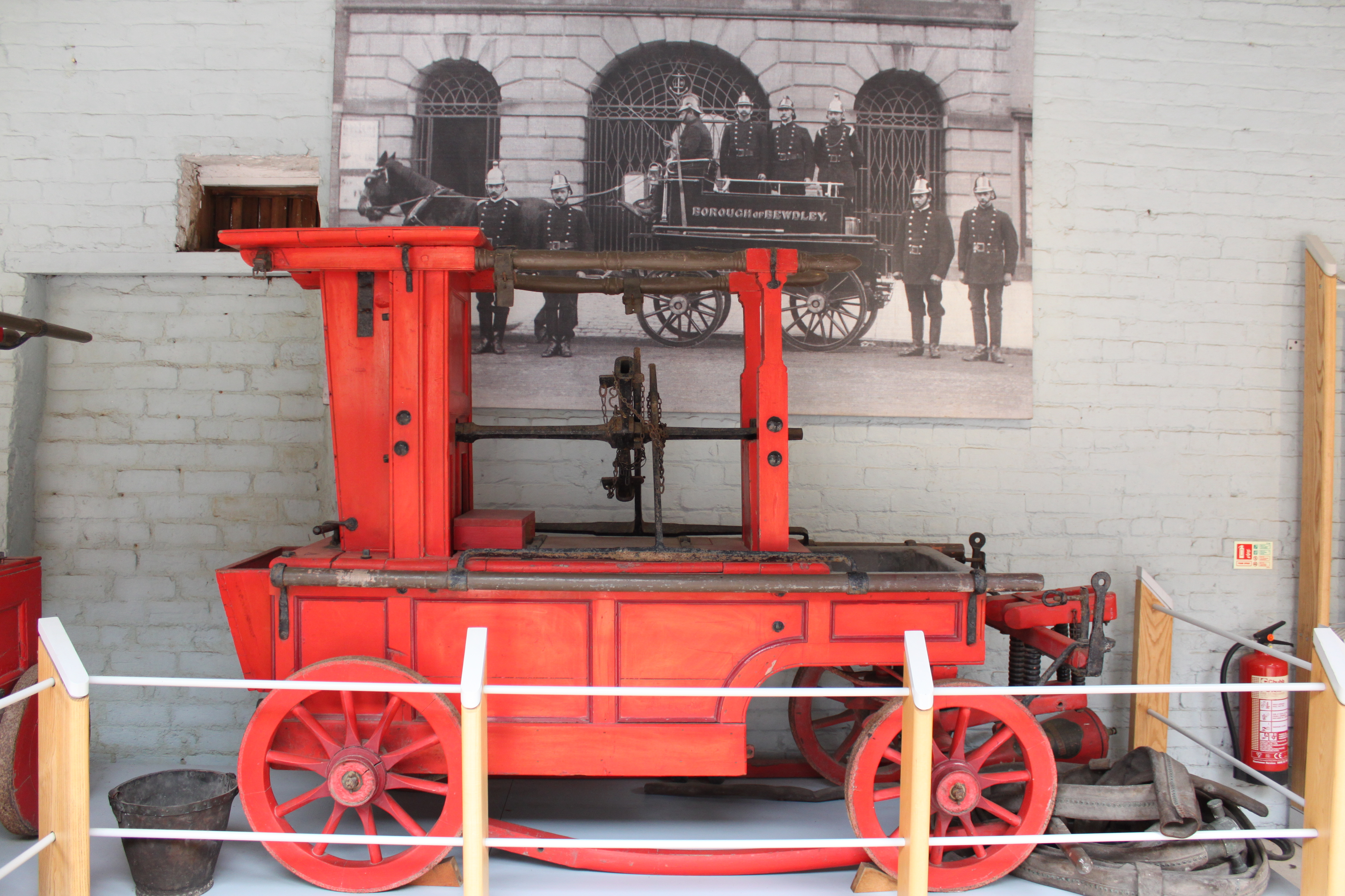 old fire engine exhibited behind roped off area