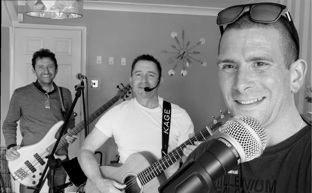 3 people 2 with guitars smiling at camera