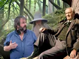 three men sat at bottom of tree one wearing a wizard's hat!
