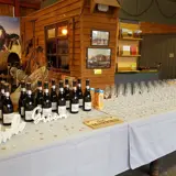 champagne glasses, bottles, bride and groom sign on table