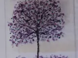 a piece of art made from glass fusing to create a tree