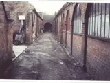 dirt track in between brick built arches along either side