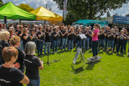 large choir in semi circle around conductor