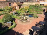 aerial view of ornate herb garden and pond