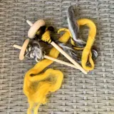 two spinning and weaving spindles